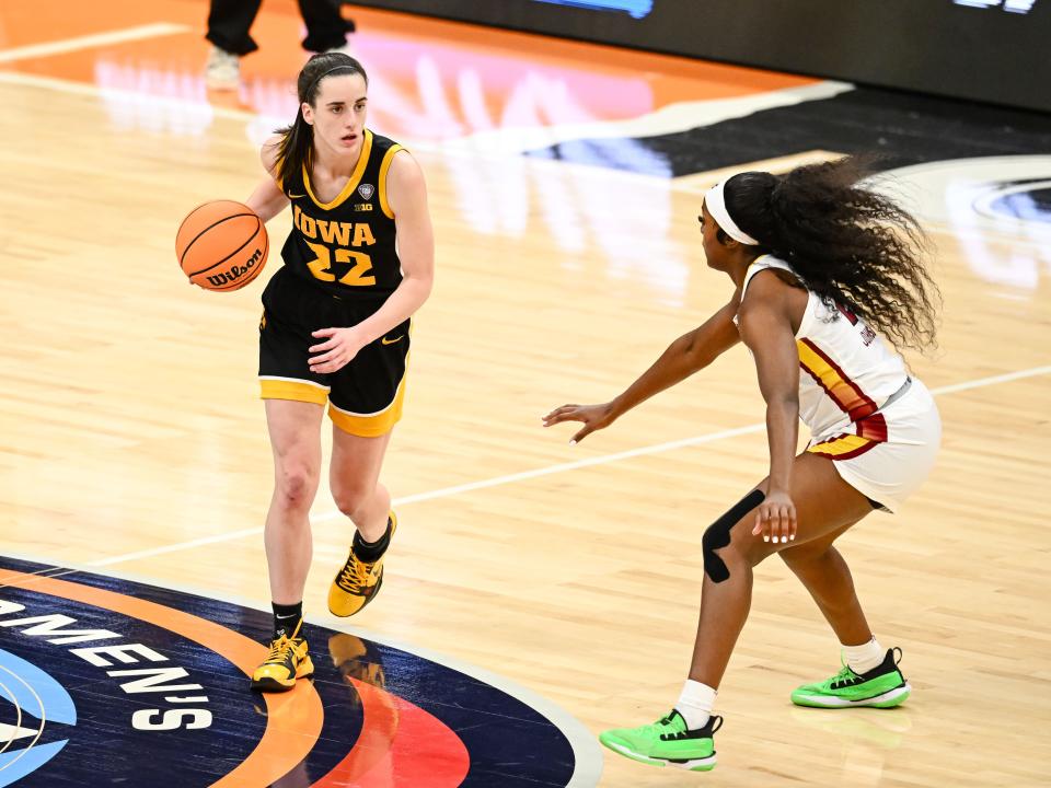 Caitlin Clark dribbles against South Carolina's Raven Johnson in the 2024 NCAA Women's Basketball Tournament Championship.