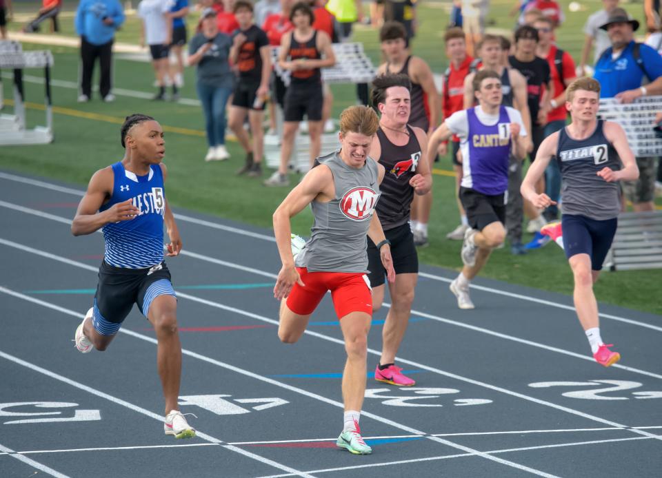 Limestone's Kamar Sanders, far left, edges out Morton's Christopher Schaff by 0.03 seconds to win the 100-meter dash during the Class 2A Galesburg Sectional boys track and field meet Thursday, May 16, 2024 at Galesburg High School. Sanders won with 10.99 seconds while Schaff finished at 11.02 seconds.