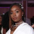 Kiki Layne demonstrates a super-cute way to style lob-length box braids. Her stylist pulled one side of her hair back behind her ears, wrapping the braids in what appears to be silver elastic.