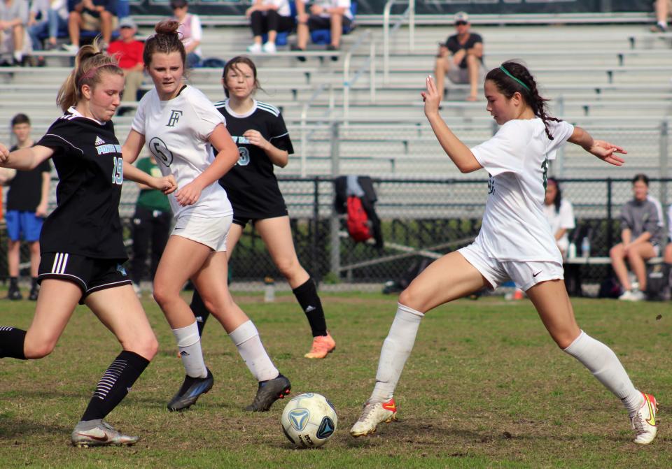 Ponte Vedra defender Hadley Conway (19) and Fleming Island midfielder Taylor Tamares (16) challenge for possession during the teams' 2022 playoff meeting. The Class 6A powers meet again Friday.