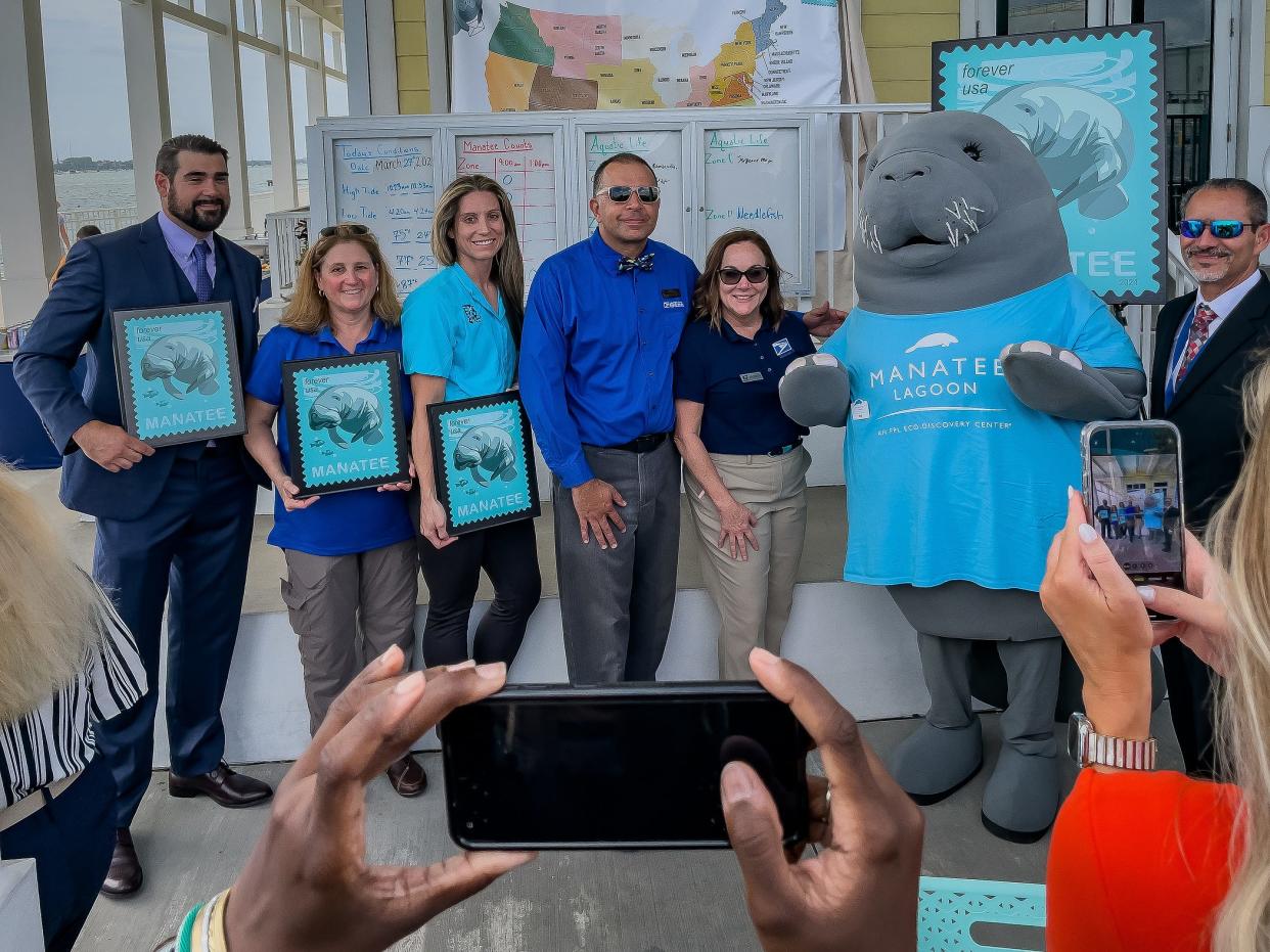 A new "Save Manatees" stamp was unveiled during a ceremony on Manatee Appreciation Day at Manatee Lagoon in West Palm Beach, Fla., on March 27, 2024. The stamp is the result of a collaborative effort between Manatee Lagoon with the United States Postal Service. Event honorees pose with a the Manatee Lagoon mascot during the afternoon event.