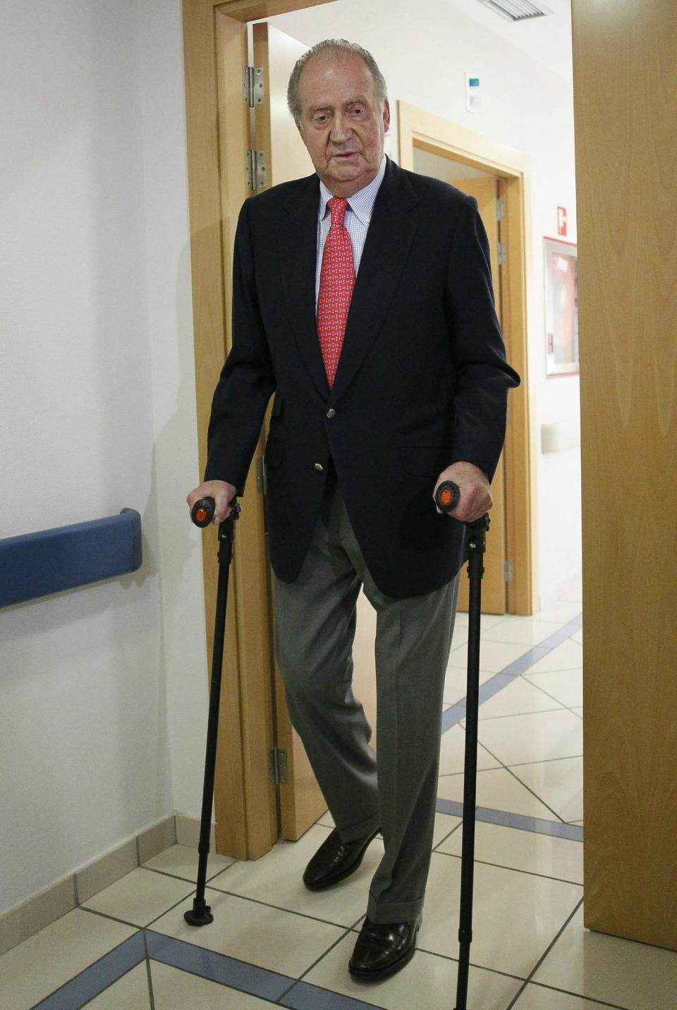 Spain's King Juan Carlos prepares to leave a hospital in Madrid Wednesday April 18, 2012. Spain's King Juan Carlos says he is sorry for having gone on African elephant-hunting trip. In an unprecedented gesture, the 74-year-old monarch said he was "very sorry. I made a mistake. It won't happen again." The king came under scathing criticism this week after he went on a safari trip to Botswana as Spain writhes in its one of its worst ever economic crises. The trip came to light when the king ended up having to be taken to hospital for hip treatment after having fallen. (AP Photo/Paco Campos,Pool)