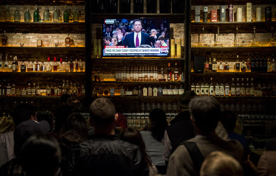 <p>The crowd gathered at The Partisan bar Comey watch party in Washington watch as former FBI Director James Comey arrives to testify during the Senate Select Intelligence Committee hearing on June 8, 2017. (Bill Clark/CQ Roll Call) </p>