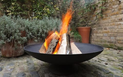 Cast iron disc brazier  - Credit: Julia Leakey 