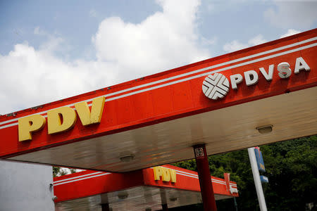 FILE PHOTO: The corporate logo of the state oil company PDVSA is seen at a gas station in Caracas, Venezuela, August 25, 2017. REUTERS/Andres Martinez Casares/File Photo