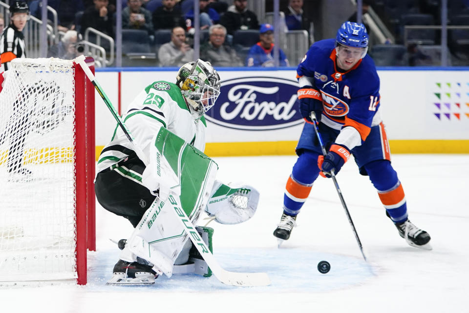 Dallas Stars goaltender Jake Oettinger (29) stops a shot on goal by New York Islanders' Josh Bailey (12) during the second period of an NHL hockey game Tuesday, Jan. 10, 2023, in Elmont, N.Y. (AP Photo/Frank Franklin II)