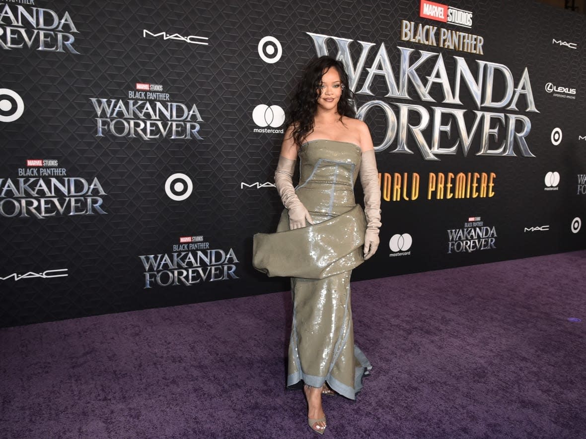 Rihanna arrives at the world premiere of Black Panther: Wakanda Forever on Wed., Oct. 26, 2022, at the El Capitan Theatre in Los Angeles. The singer released her first song in six years on Friday, the first of two contributions to the sequel film's soundtrack. (Richard Shotwell/Invision/The Associated Press - image credit)