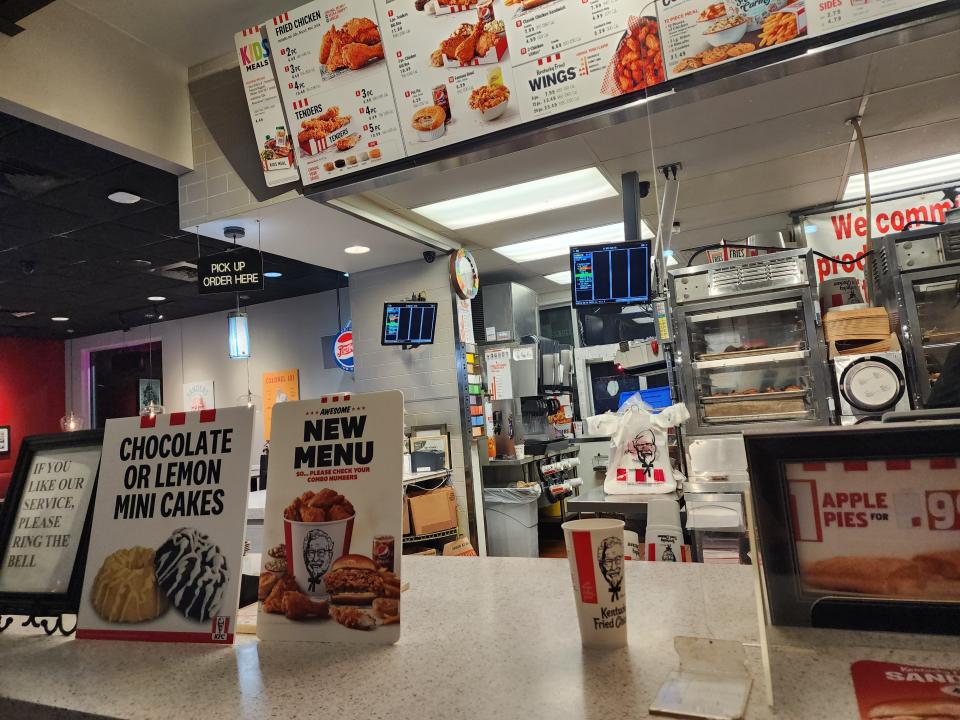 Front counter and digital menu at KFC