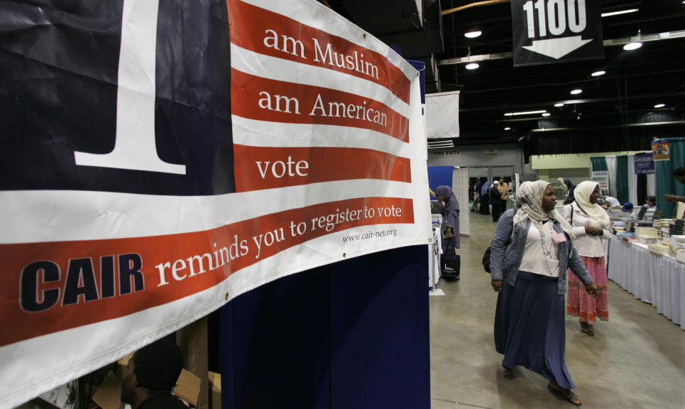 A sign at the 43rd annual Islamic Society of North America convention encourages participants to register to vote. (Photo: ASSOCIATED PRESS)