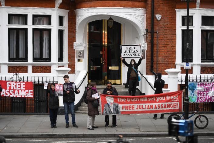 Supporters of WikiLeaks founder Julian Assange display banners and placards as they gather outside the Ecuadorian Embassy in London, where Assange has been living for more than six years and will meet with an independent rights expert (AFP Photo/Daniel LEAL-OLIVAS)