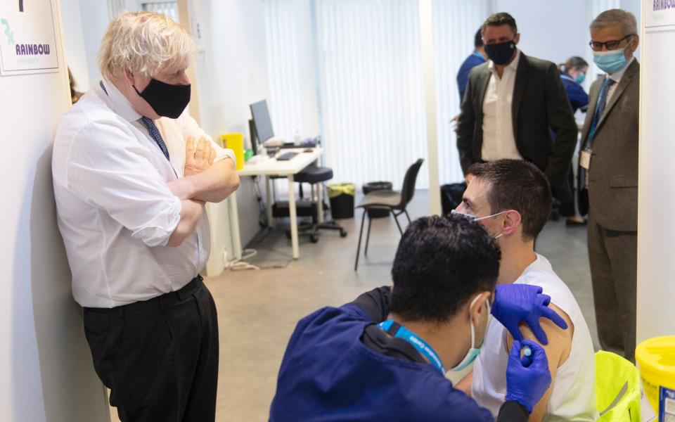 Boris Johnson watched on as boosters were administered in Milton Keynes on Wednesday - Geoff Pugh/WPA Pool/Getty Images