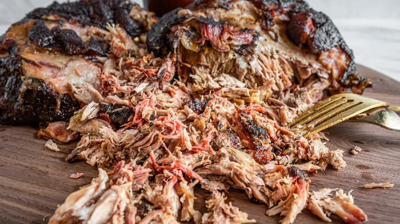 Smoked pulled pork on board