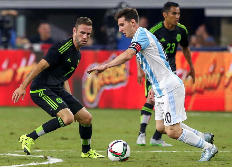 Argentina's Lionel Messi (10) tries to work around Mexico's Miguel Layun, left, during the first half of a friendly on Tuesday, Sept. 8, 2015, at AT&T Stadium in Arlington, Texas. (Steve Nurenberg/Fort Worth Star-Telegram/Tribune News Service via Getty Images)