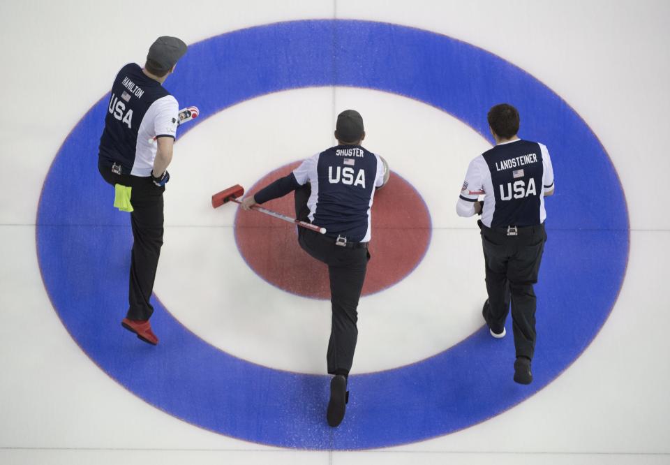 United States skip John Shuster, center, makes a shot as, second, Matt Hamilton and lead, John Landsteiner look on during the 4th draw against Scotland at the men’s World Curling Championships in Edmonton, Alberta, Sunday, April 2, 2017. (AP)