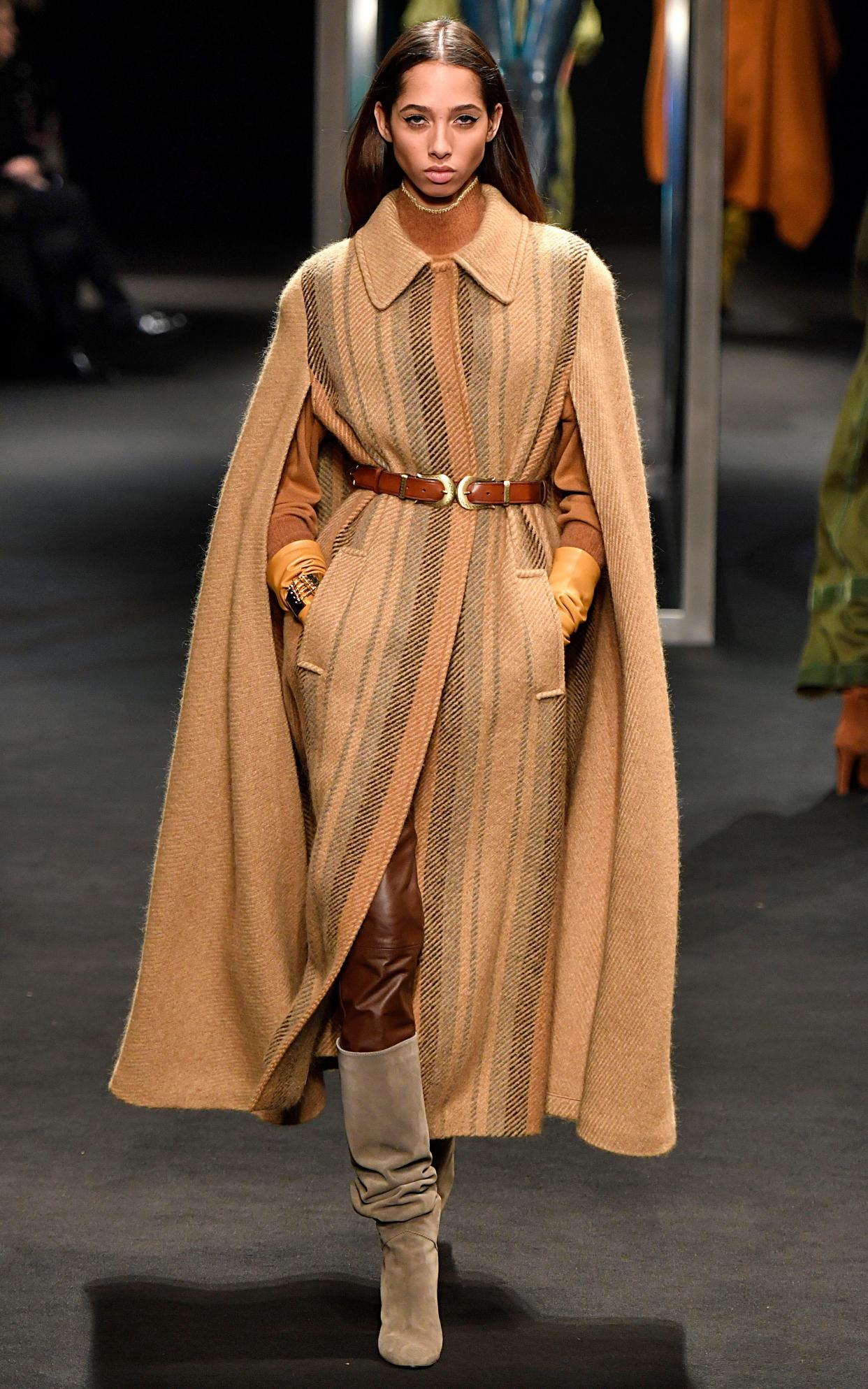 A model walks the runway in a cape coat at the Alberta Ferretti Ready to Wear Fall/Winter 2018-2019 - Victor VIRGILE/Gamma-Rapho