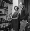 <p>Actors Paul Newman and Joanne Woodward met while starring together in the Broadway show <em>Picnic </em>and they married in 1958. They pose in their 11th Street home with some of their awards.</p>