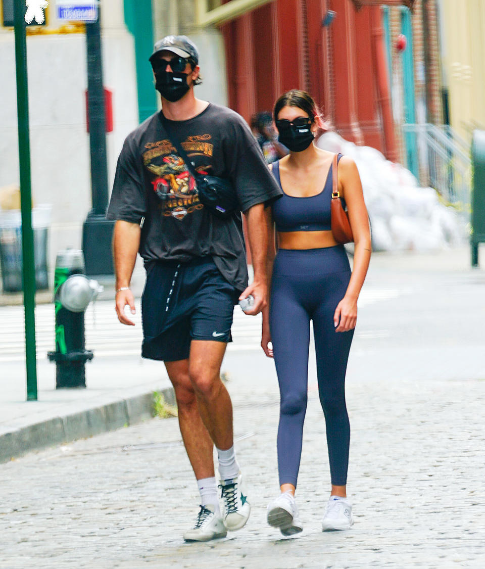 Gerber and Elordi walk down the street together while wearing workout gear