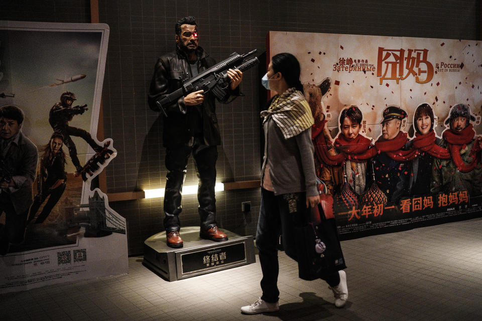 WUHAN, CHINA - JULY 20: (CHINA OUT)The audience wear a mask While past movie posters during the Spring Festival in a cinema at Wuhan on July 20, 2020 in Wuhan ,Hubei Province,China.Taking various measures against COVID-19, cinemas in the city reopened in an orderly manner on Monday. The China Film Administration, in a circular last week, allowed cinemas in low-risk areas to resume operation with effective epidemic prevention measures in place. (Photo by Getty Images)