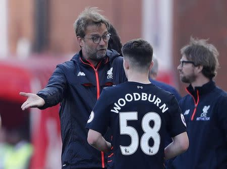 Britain Football Soccer - Stoke City v Liverpool - Premier League - bet365 Stadium - 8/4/17 Liverpool manager Juergen Klopp speaks with Ben Woodburn Action Images via Reuters / Carl Recine Livepic