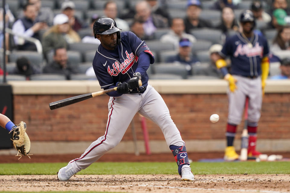 Atlanta Braves' Ronald Acuna Jr. hits an RBI single off New York Mets relief pitcher Trevor Williams in the sixth inning of a baseball game, Wednesday, May 4, 2022, in New York. (AP Photo/John Minchillo)
