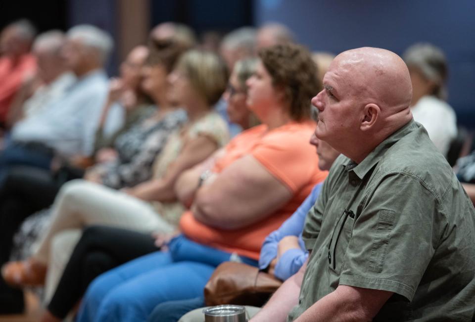 The audience listens as David Magee, author and the creator of The William Magee Institute for Student Wellbeing at the University of Mississippi, speaks about how adolescents nationwide are struggling with mental health and substance misuse issues during CivicCon at the Brownsville Community Center in Pensacola on Tuesday, Aug. 15, 2023.