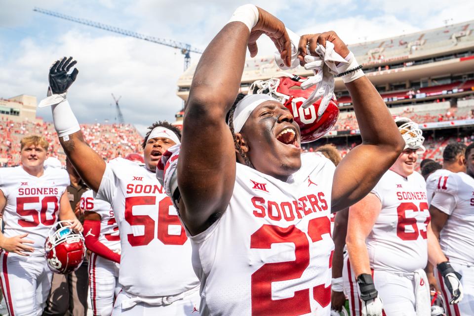 Sep 17, 2022; Lincoln, Nebraska, USA; Oklahoma Sooners linebacker DaShaun White (23) celebrates with his teammates after defeating the Nebraska Cornhuskers at Memorial Stadium. Mandatory Credit: Dylan Widger-USA TODAY Sports