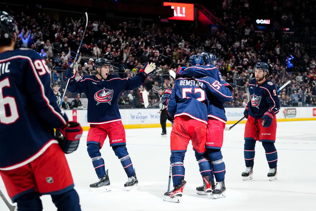 Oct 24, 2023; Columbus, Ohio, USA; Columbus Blue Jackets center Cole Sillinger (4) and center Adam Fantilli (11) celebrate a goal by Columbus Blue Jackets right wing Emil Bemstrom (52) during the first period of the NHL game against the Anaheim Ducks at Nationwide Arena.