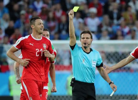 Soccer Football - World Cup - Group E - Serbia vs Switzerland - Kaliningrad Stadium, Kaliningrad, Russia - June 22, 2018 Serbia's Nemanja Matic is shown a yellow card by referee Felix Brych REUTERS/Mariana Bazo