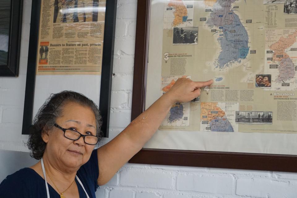 Sun Thompson points to the island of Jeju in South Korea, where she was born and raised. Chang's Fish Market, 110 Johnson St., Fayetteville.