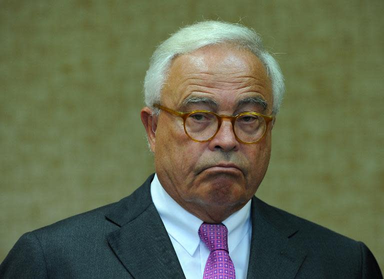 Former Deutsche Bank CEO Rolf Breuer waits for the opening of his trial at a court in Munich, southern Germany, in 2011