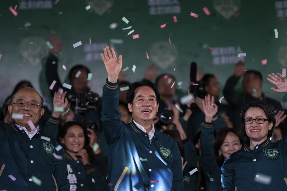 Taiwanese Vice President Lai Ching-te, also known as William Lai, left, celebrates his victory with running mate Bi-khim Hsiao in New Taipei City, Taiwan, Saturday, Jan. 13, 2024. The Ruling-party candidate has emerged victorious in Taiwan's presidential election and his opponents have conceded. (AP Photo/Louise Delmotte)