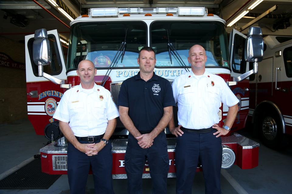 Retiring Fire Chief Todd Germain, left incoming assistant chief Jason Gionet and new chief Bill McQuillen gather together at the Portsmouth Fire Department's Station 1 Wednesday, Aug. 31, 2022.