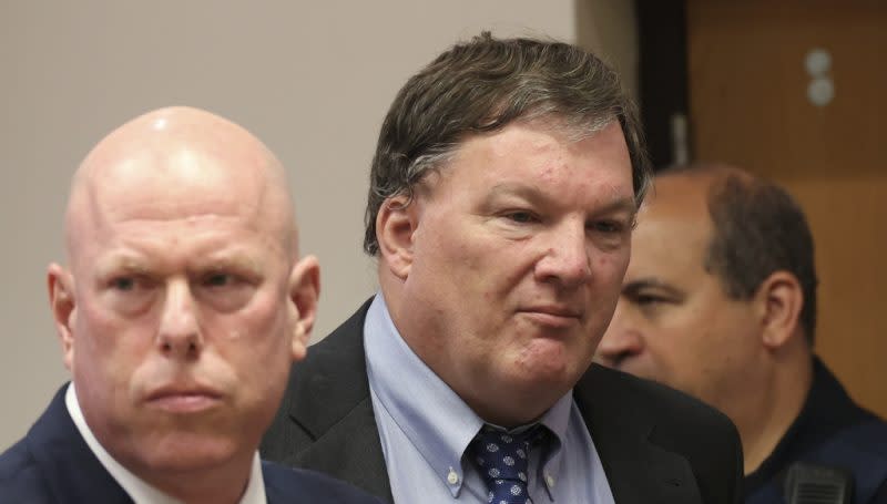 Rex Heuermann, center, charged in the Gilgo Beach serial killings on Long Island, appears for a hearing at Suffolk County Court in Riverhead, N.Y., Thursday, June. 6, 2024. Heuermann was charged Thursday in the deaths of two more, after prosecutors said they gathered new DNA evidence and found a computer document he had used to “blueprint” his crimes. (James Carbone/Newsday via AP, Pool)