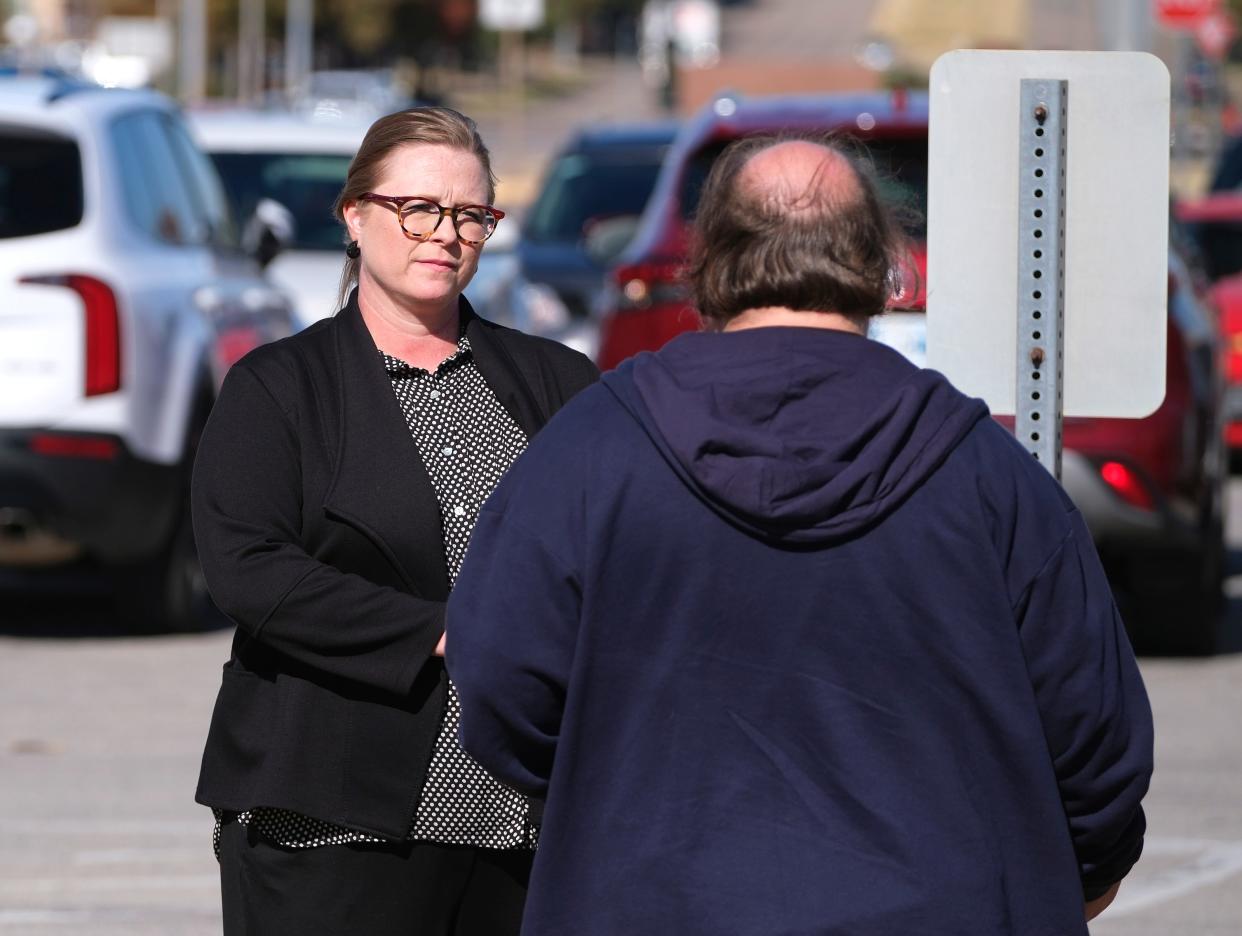 Jennifer Wilkinson, head of school at Insight School of Okahoma, speaks with a supporter Nov. 15 before an Oklahoma State Board of Education hearing. Wilkinson opposed rule changes that would effectively shut down the state's only alternative virtual charter school.