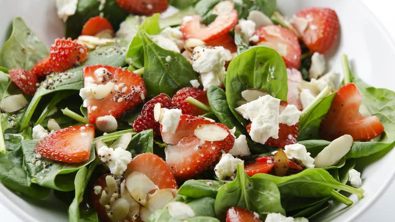 Feta and strawberry salad in bowl