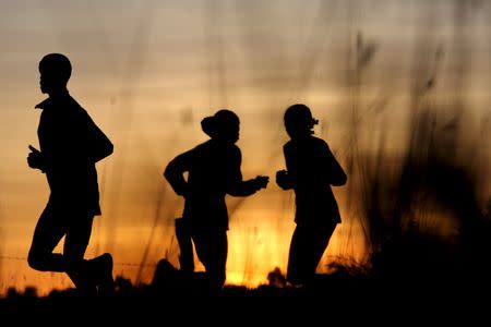 Athletes exercise in the early morning in Iten, near the town of Eldoret, western Kenya, March 21, 2016. REUTERS/Siegfried Modola