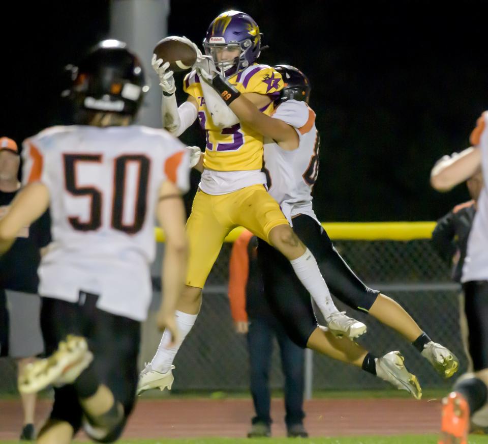 Farmington's Jack Gronewold snags a pass against Elmwood/Brimfield in the second half of their varsity football game Friday, Sept. 22, 2023 in Farmington. The Farmers defeated the Trojans 30-26.