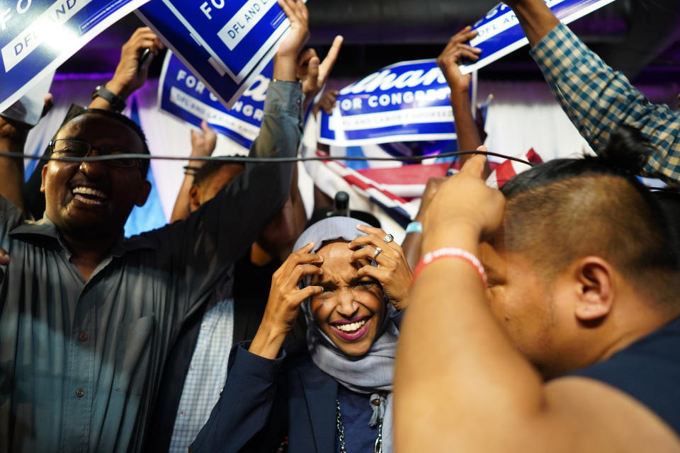 Minnesota Rep. Ilhan Omar, center, celebrates with her supporters after her Congressional 5th District primary victory, Tuesday, Aug. 14, 2018, in Minneapolis. (Mark Vancleave/Star Tribune via AP)