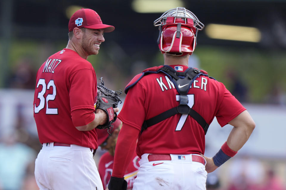 St. Louis Cardinals starting pitcher Steven Matz (32) talks with catcher Andrew Knizner (7) during the third inning of a spring training baseball game against the Washington Nationals, Sunday, March 12, 2023, in Jupiter, Fla. (AP Photo/Lynne Sladky)