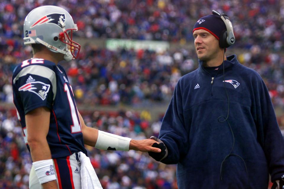 When Patriots starting quarterback Drew Bledsoe (right) was injured early in the 2001 season, Tom Brady never gave back the job. (Photo by Jim Davis/The Boston Globe via Getty Images)