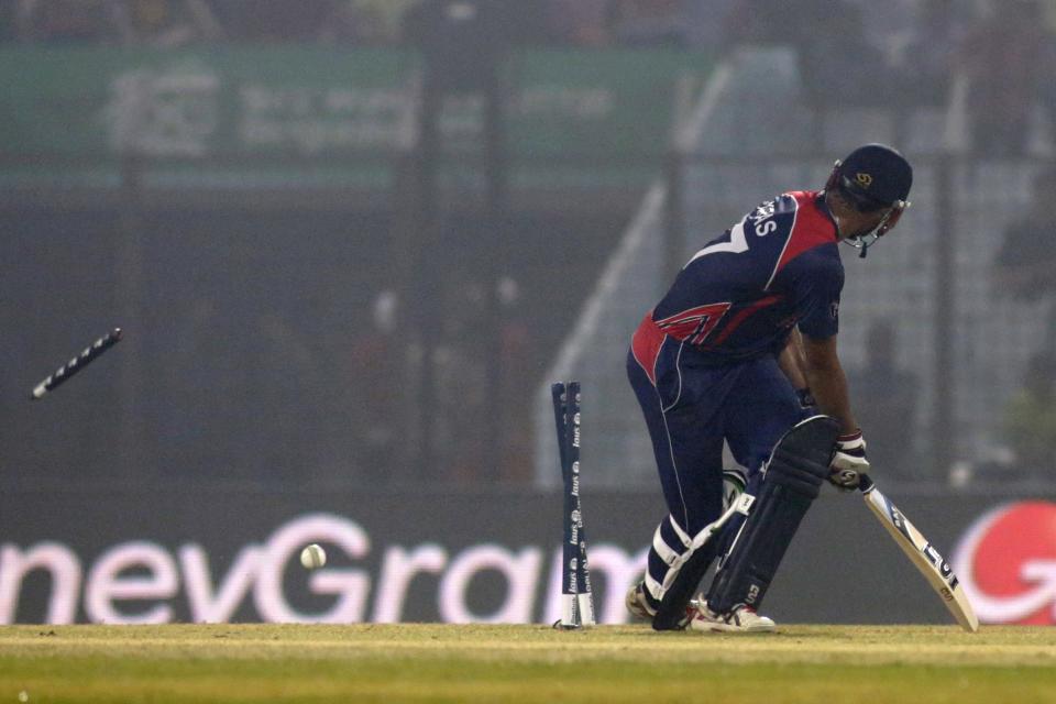Nepal captain Paras Khadka looks back as he is bowled out during their ICC Twenty20 Cricket World Cup match against Bangladesh in Chittagong, Bangladesh, Tuesday, March 18, 2014. (AP Photo/Bikas Das)
