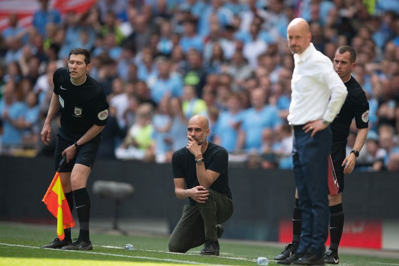 Erik ten Hag stands on the Wembley touchline as Pep Guardiola kneels during last season's FA Cup final.
