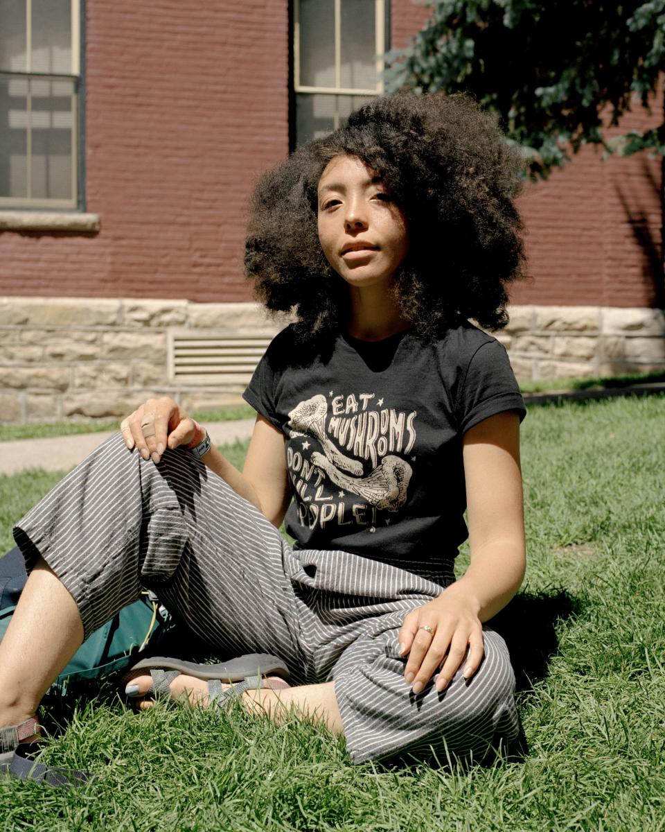 Lux Sterling, a volunteer at the festival, wearing a shirt by Corvidopolis, a “weird nature”-themed hand-printing company that set up shop in Telluride during the festival.