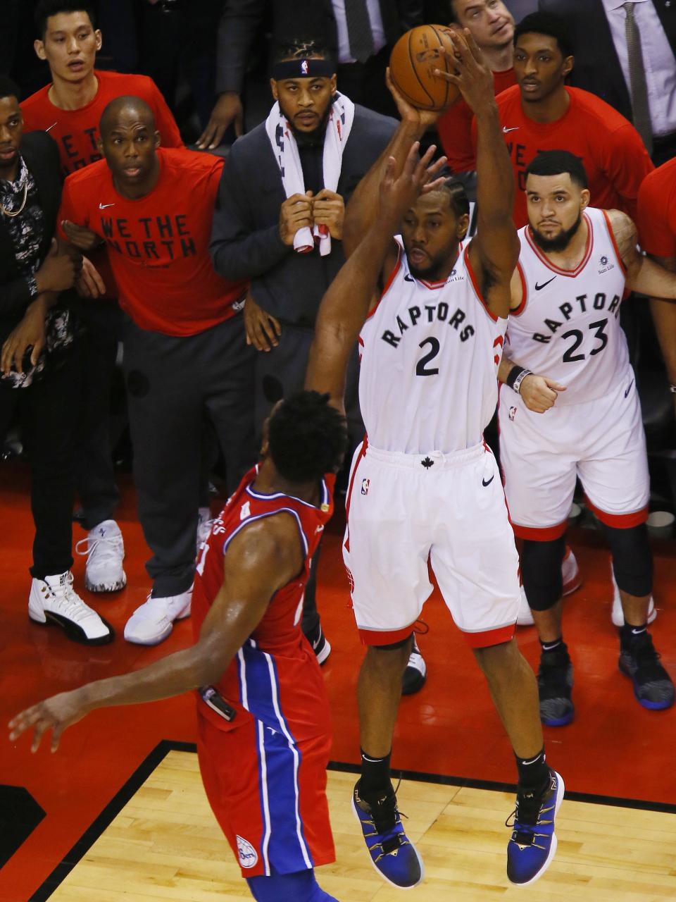 May 12, 2019; Toronto, Ontario, CAN; Toronto Raptors forward Kawhi Leonard (2) makes the game winning basket over Philadelphia 76ers center Joel Embiid (21) during game seven of the second round of the 2019 NBA Playoffs at Scotiabank Arena. Toronto defeated Philadelphia. Mandatory Credit: John E. Sokolowski-USA TODAY Sports