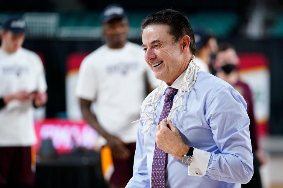 Rick Pitino celebrates Iona's MAAC championship.