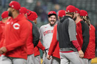 Cincinnati Reds starting pitcher Wade Miley, center, smiles as teammates congratulate him after he pitched a no-hitter in a baseball game against the Cleveland Indians, Friday, May 7, 2021, in Cleveland. (AP Photo/Tony Dejak)