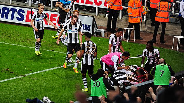 Somewhere at the bottom of the pile of players is Dwight Gayle. Pic: Getty