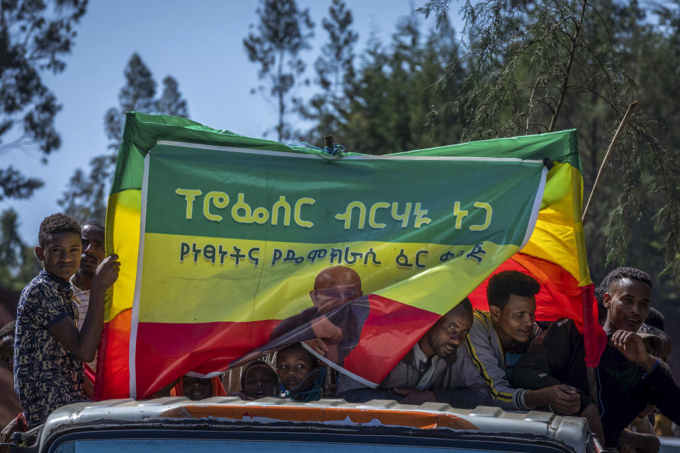 FILE - In this Saturday, May 22, 2021 file photo, supporters attend an election rally of the Ethiopian Citizens for Social Justice (EZEMA) opposition party, also attended by party leader Berhanu Nega, at Agena town in the Southern Nations, Nationalities, and Peoples' Region of Ethiopia. The country is due to vote in a general election on Monday, June, 21, 2021. (AP Photo/Mulugeta Ayene, File)