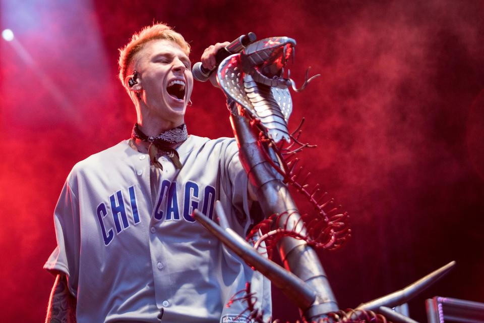 As his rap alter ego Machine Gun Kelly, Colson Baker performs during Fall Out Boy's "The MANIA Tour" last fall in Chicago. He's working on releasing a new album this year.