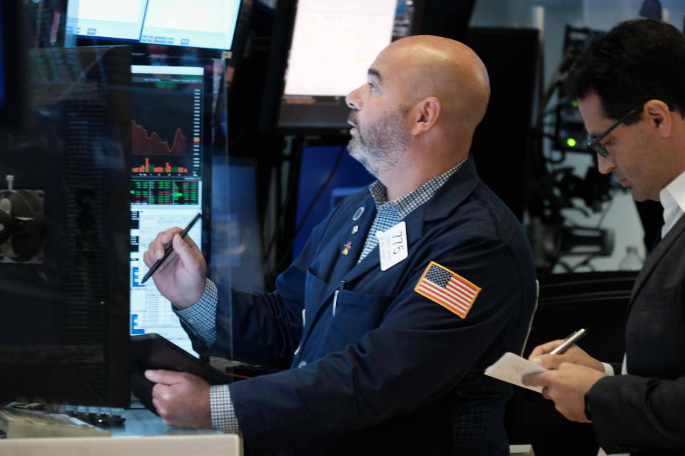 NEW YORK, NEW YORK - SEPTEMBER 30: Traders work on the floor of the New York Stock Exchange (NYSE) on September 30, 2021 in New York City. In afternoon trading the Dow was down over 250 points as investors continue to worry about inflation, wages and supply chain issues. (Photo by Spencer Platt/Getty Images)